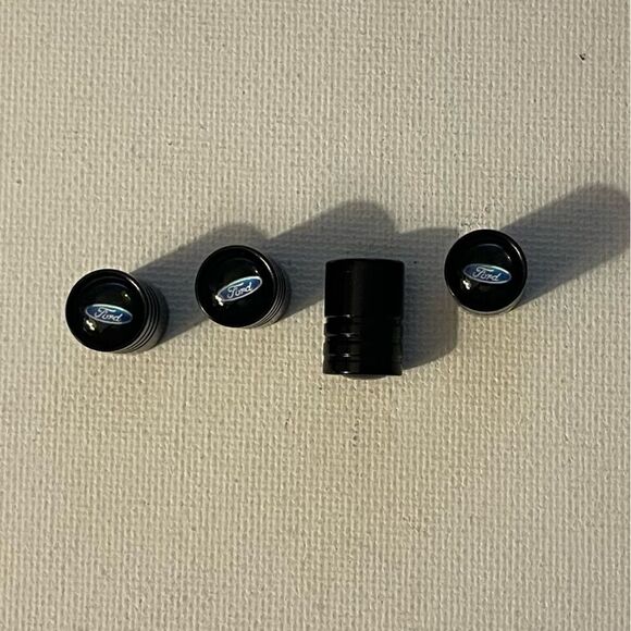 Ford valve Stem caps in Black set of 4 NWT - Picture 1 of 4